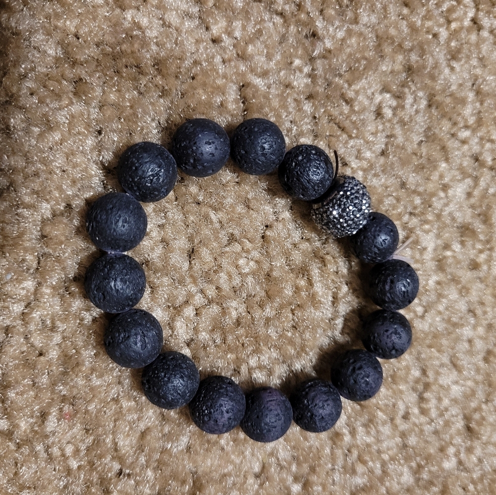 Lava Rock Bracelet for use with essential oils has rhinestone bead in the middle